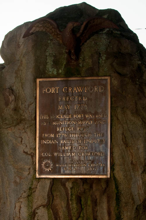 Monument to Colonel William Crawford. Dedicated by the Daughters of the American Revolution. Monument says, "FORT CRAWFORD ERECTED MAY 1775 THIS STOCKADE WAS USED AS A MUNIITION-SUPPLY AND REFUGE POST FROM 1776 THROUGH THE INDIAN RAIDS OF 1791-1793 NAMED FOR COL. WILLIAM CRAWFORD. PLACED BY MASSY HARBISON CHAPTER D.A.R. 1942)